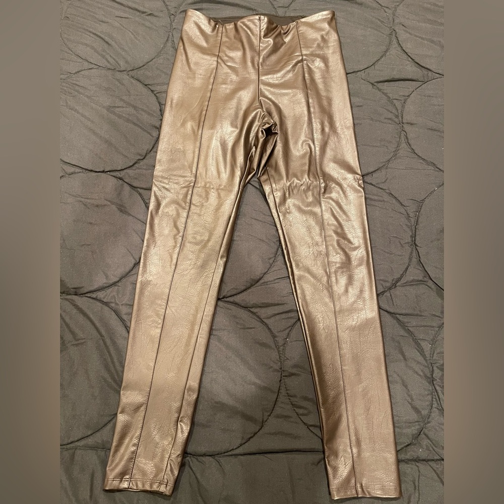Brown vegan leather pants .
